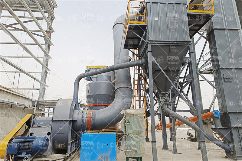 Raw mineral ore on conveyor belt in factory