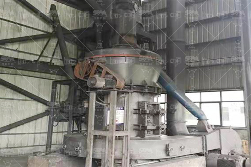Vertical roller mill in operation for particle size control